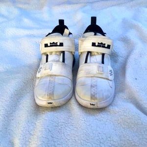 Black and white Nike Lebrons.